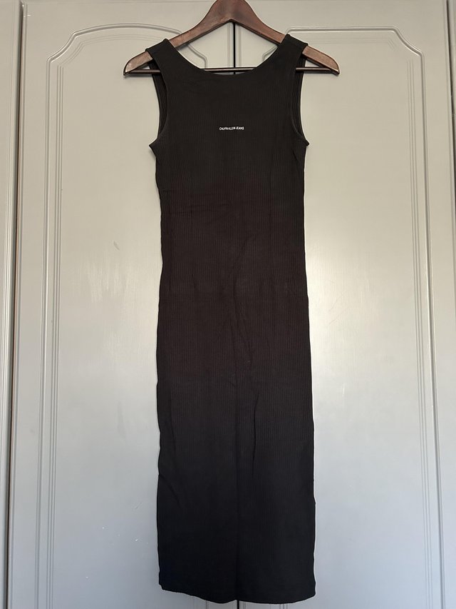 Preview of the first image of Calvin Klein Black Midi Dress Size XS.