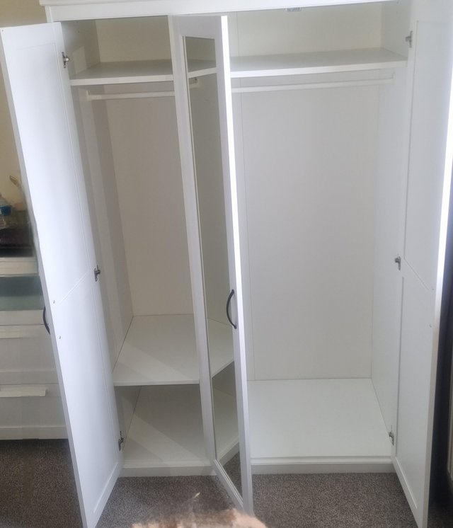 Preview of the first image of White 3 door Ikea wardrobe with mirror.