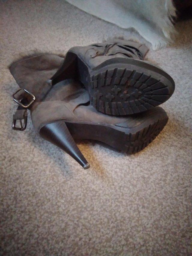 Preview of the first image of Ladies faux fur grey ankle boots size 39.