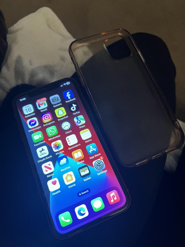 Preview of the first image of Unlocked red iPhone 11 with clear case.
