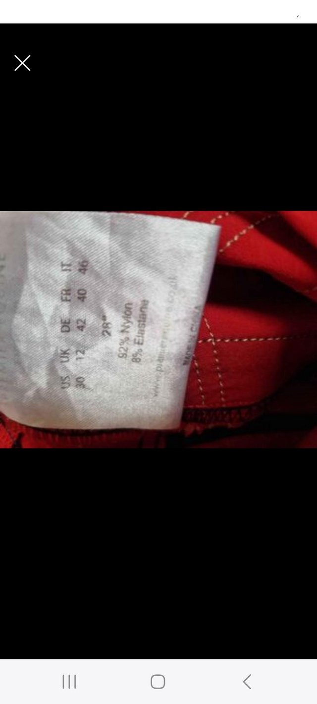 Preview of the first image of Like new premier equine red and navy breeches.