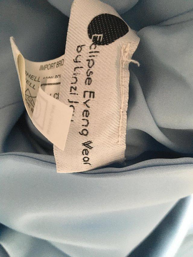 Preview of the first image of Beautiful gown size 14 pale blue with white inset.