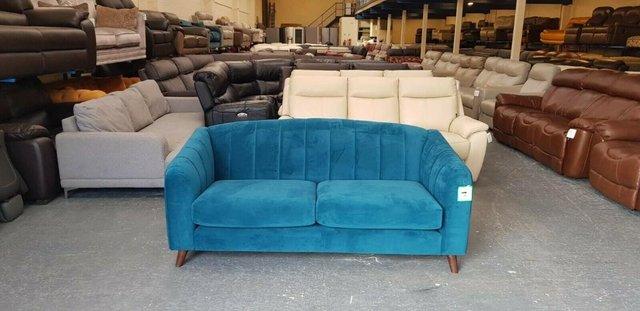 Preview of the first image of Development ex display blue chenille fabric sprung back sofa.