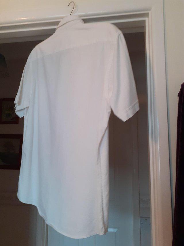 Preview of the first image of Four Men's polo t.shirt's in white (36) chest all good.