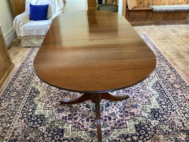Preview of the first image of Edwardian Georgian style oval extending dining table.