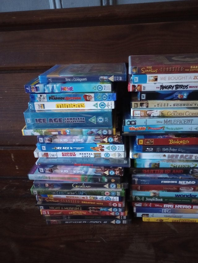 Preview of the first image of Kids/Family DVDs x 70 - majority wrapped up.