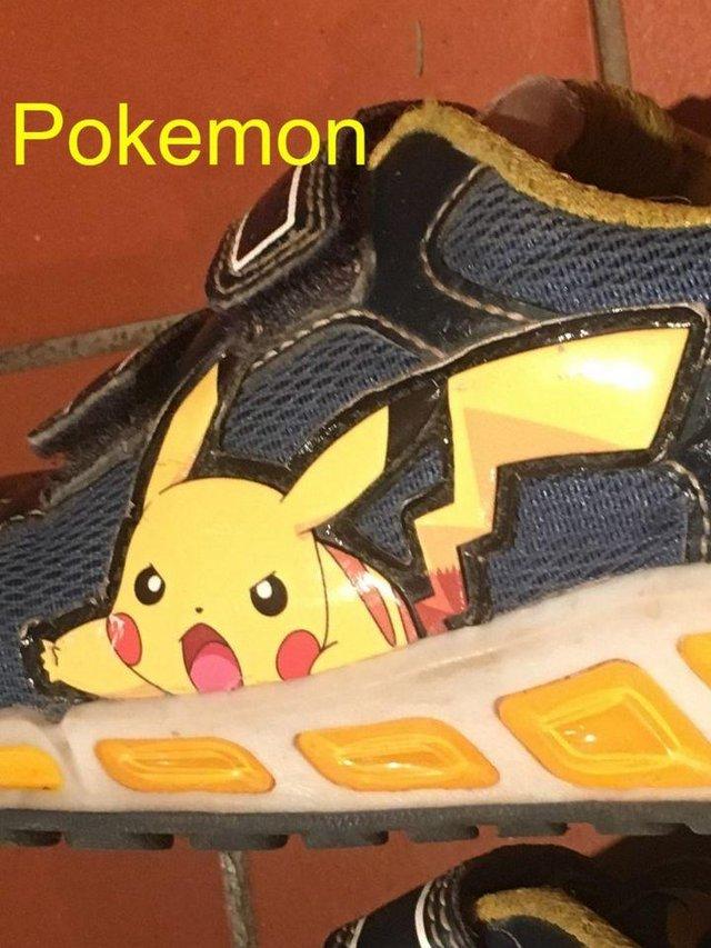 Preview of the first image of Pokemon Pikachu trainers, navy-yellow. UK 11½. Damaged..