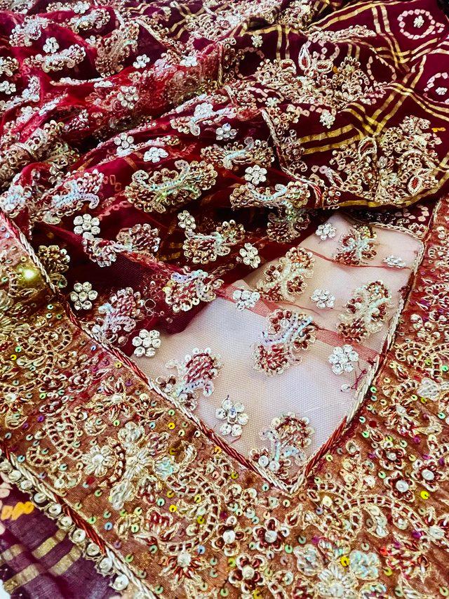 Preview of the first image of Beautiful Gharchola saree in maroon red with diamanté detail.