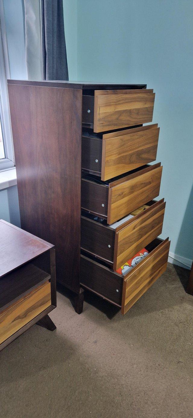 Preview of the first image of John lewis dark oak tall boy chest of drawers.
