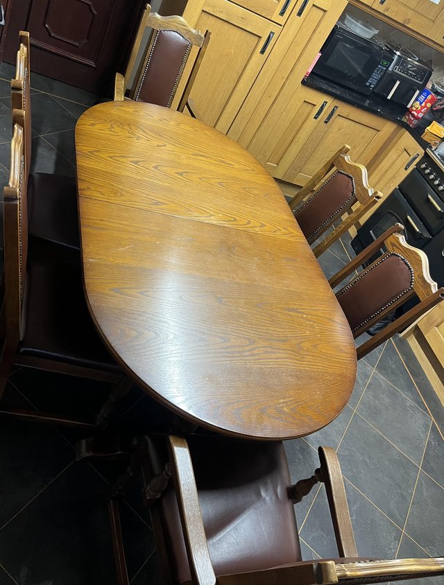 Preview of the first image of Old Charm Oval extending dining table and 6 chairs.