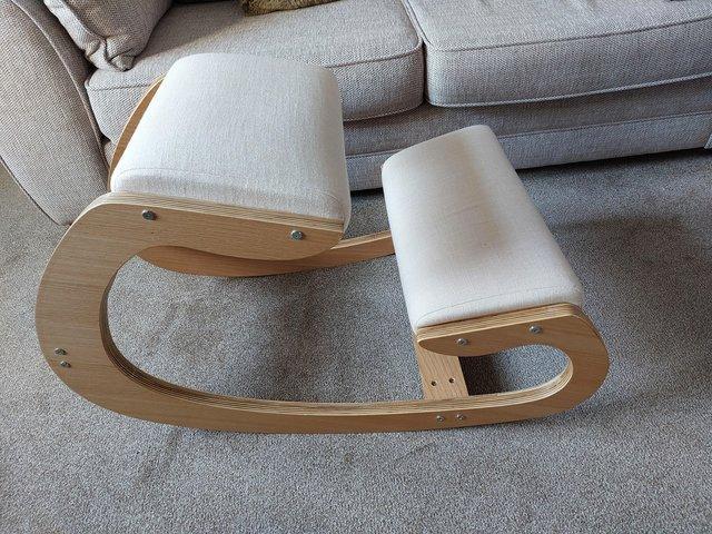 Preview of the first image of Ergonomic kneeling stool - cream fabric and light wood.