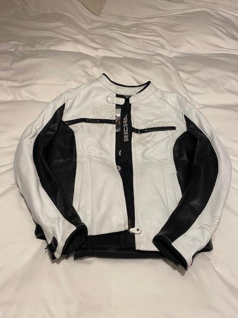 Preview of the first image of Ladies biker jacket only worn once it is as new..
