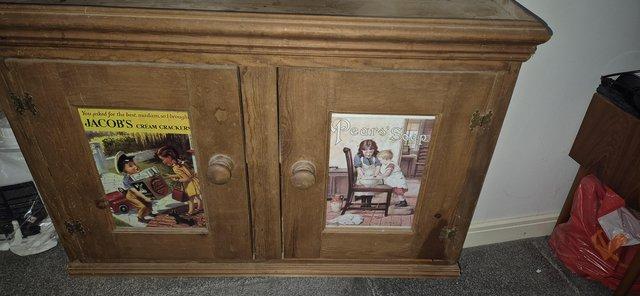 Image 1 of Hand made pine cupboard with advert inserts!