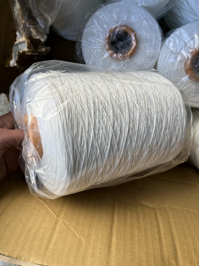 Preview of the first image of Large bobbins of white thread brand new.