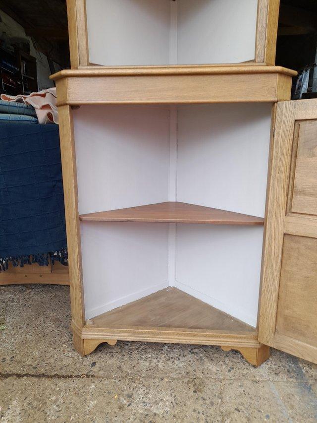 Preview of the first image of Oak corner cupboard/display ccupboard.