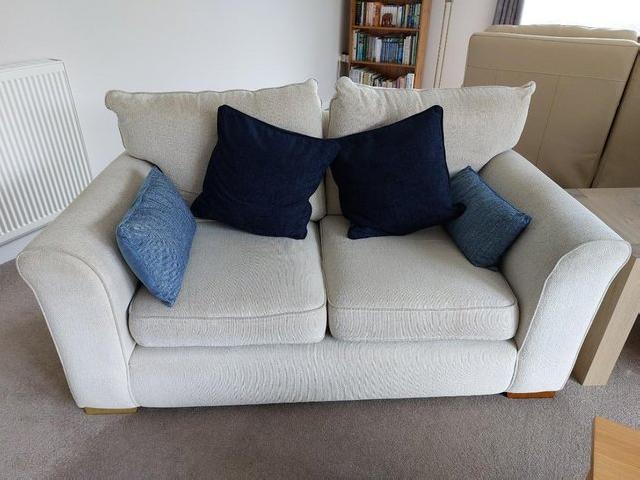 Preview of the first image of two seat sofa in cream coloured fabric.