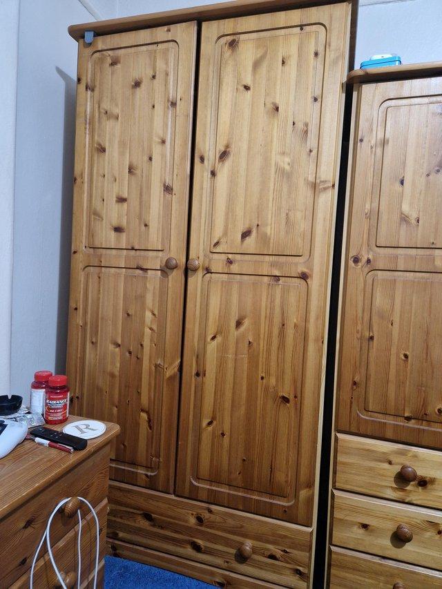 Preview of the first image of Solid pine wardrobes, two matching chest of draws bed side d.