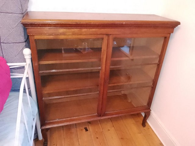 Preview of the first image of 1950s wooden bookcase, glass fronted.