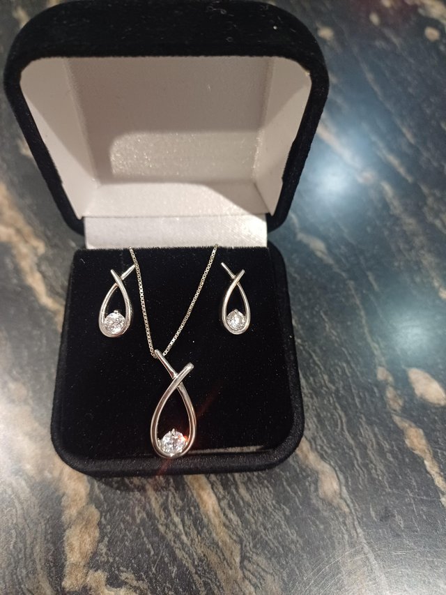 Preview of the first image of Sterling silver Love Knot earrings & pendant set Ernest Jo.