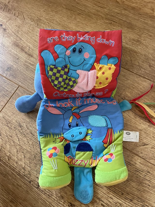 Preview of the first image of Baby toys including soft book and rattle.
