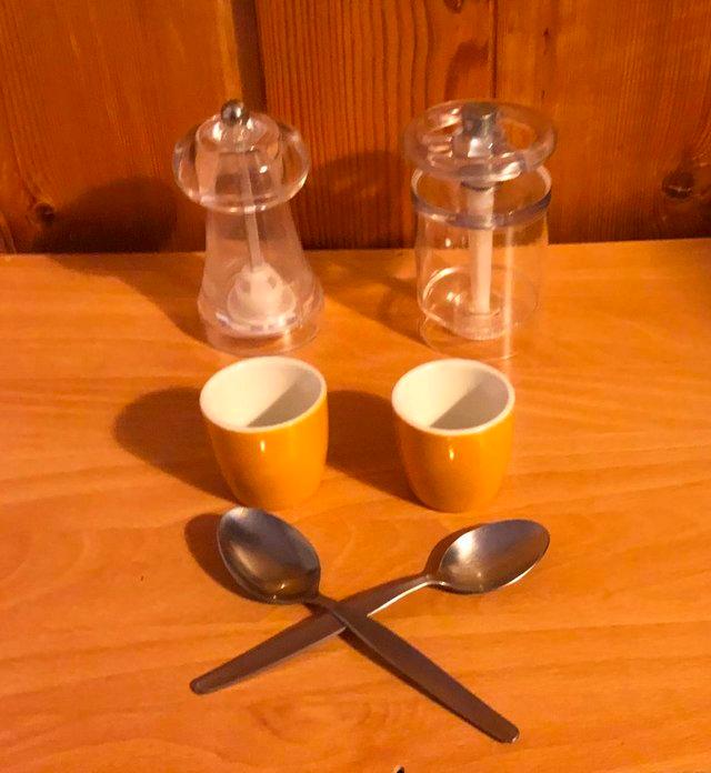 Preview of the first image of 2 NEW CHINA EGG CUPS, WITH SALT AND PEPPER MILLS.