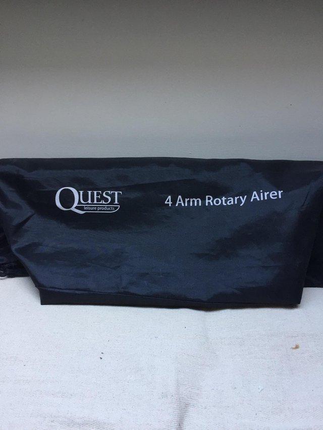 Preview of the first image of Camping Quest 4 arm rotary airer and stand.