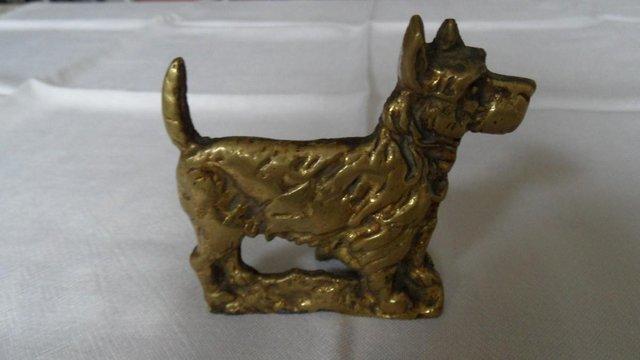 Preview of the first image of Scotty Dog Brass Candle Holder.