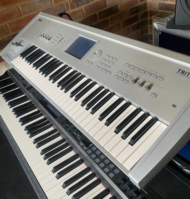 Preview of the first image of KORG TRITON WORKSTation keyboard and flight case.