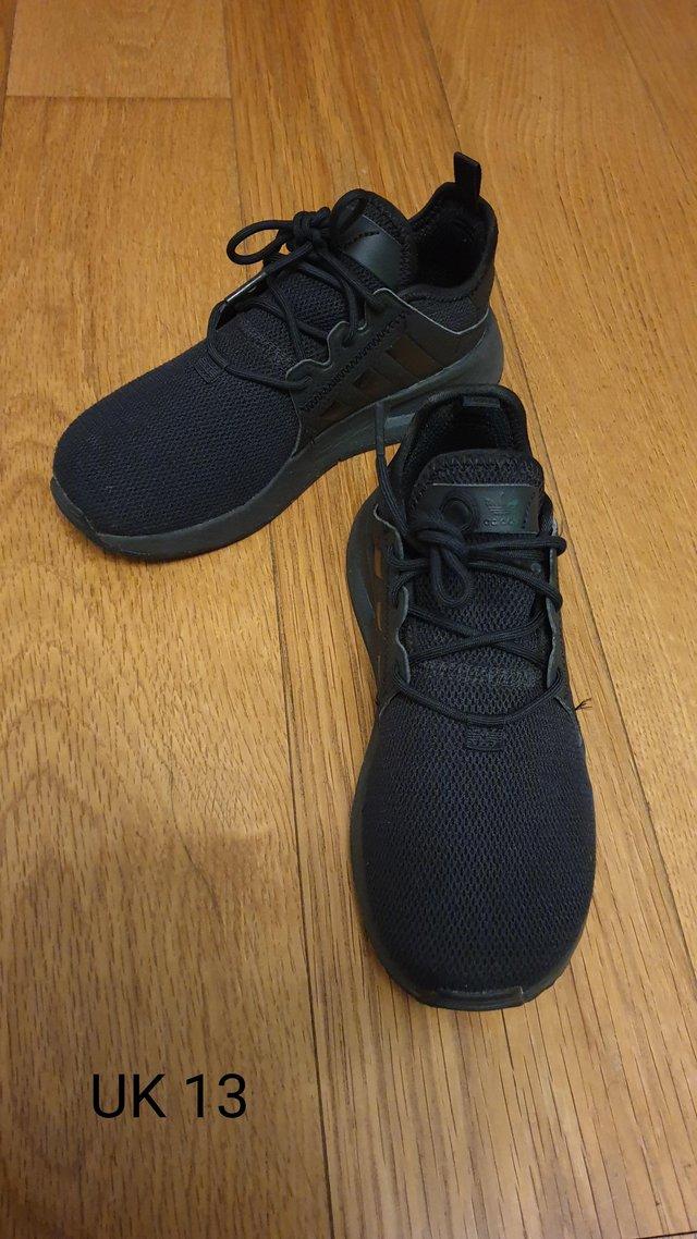 Preview of the first image of Girls Adidas Trainers UK 13 in Black.