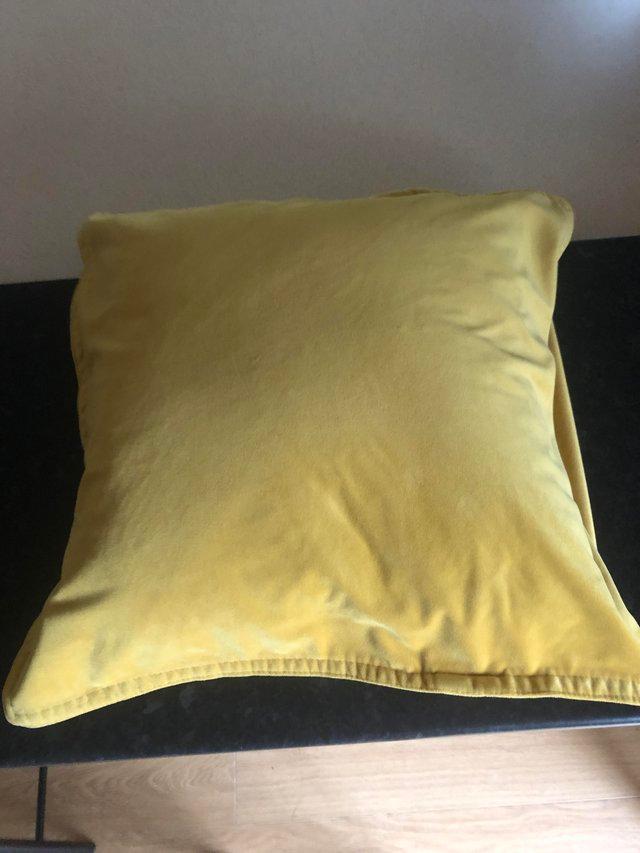 Preview of the first image of Yellow velvet cushion  covers x2.