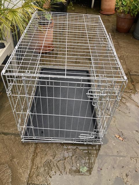 Preview of the first image of Dog crate, medium sized, easy to assemble.