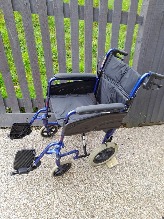 Preview of the first image of Used blue foldable wheelchair.