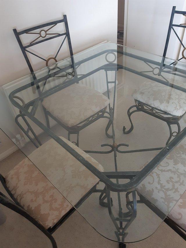 Preview of the first image of Solid wrought iron table and chairs.