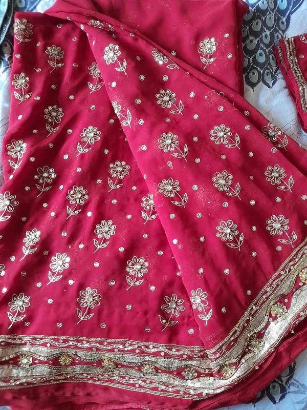 Preview of the first image of Kundan embellished red saree (party wear).