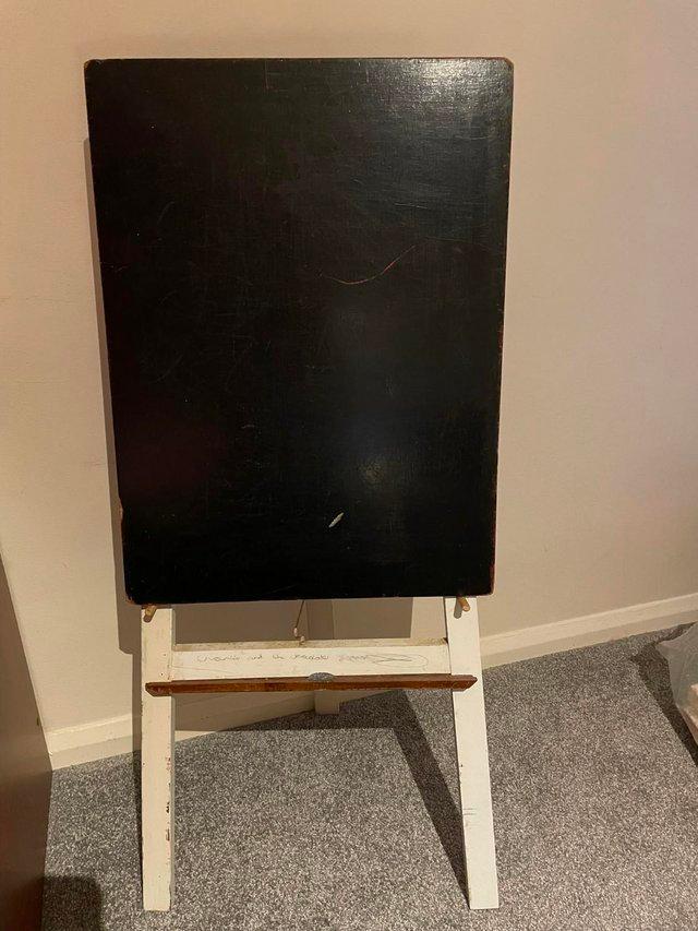 Preview of the first image of a chalkboard painted black  and easel painted white.