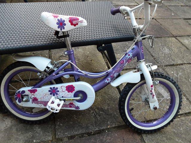 Preview of the first image of Girls bike and stabilisers.
