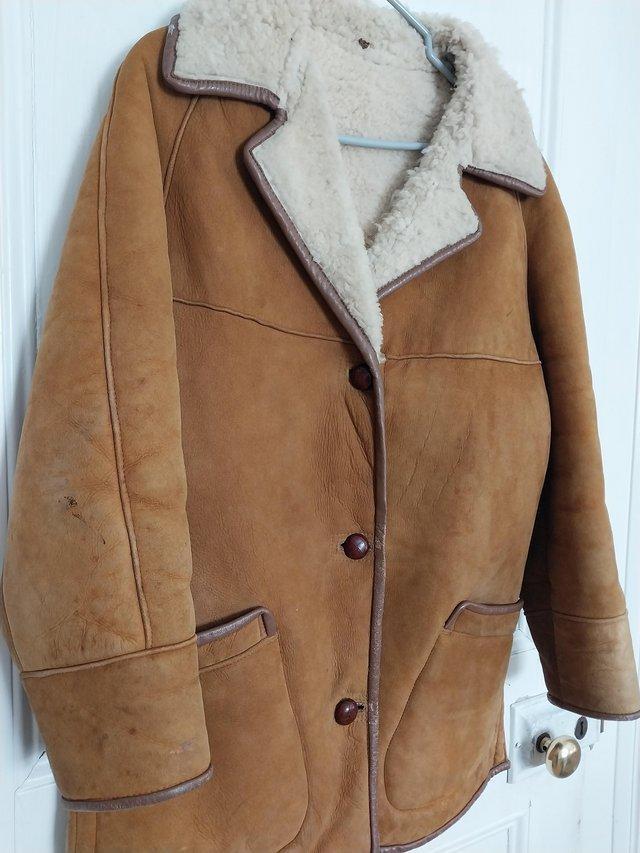 Preview of the first image of Vintage sheepskin coat suits either sex.