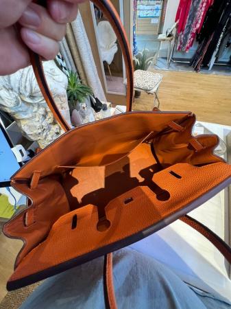 Image 3 of Orange leather bag with lock and dust bags