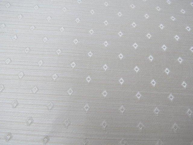 Preview of the first image of Fabric remnant Silky effect fabric with small motif.