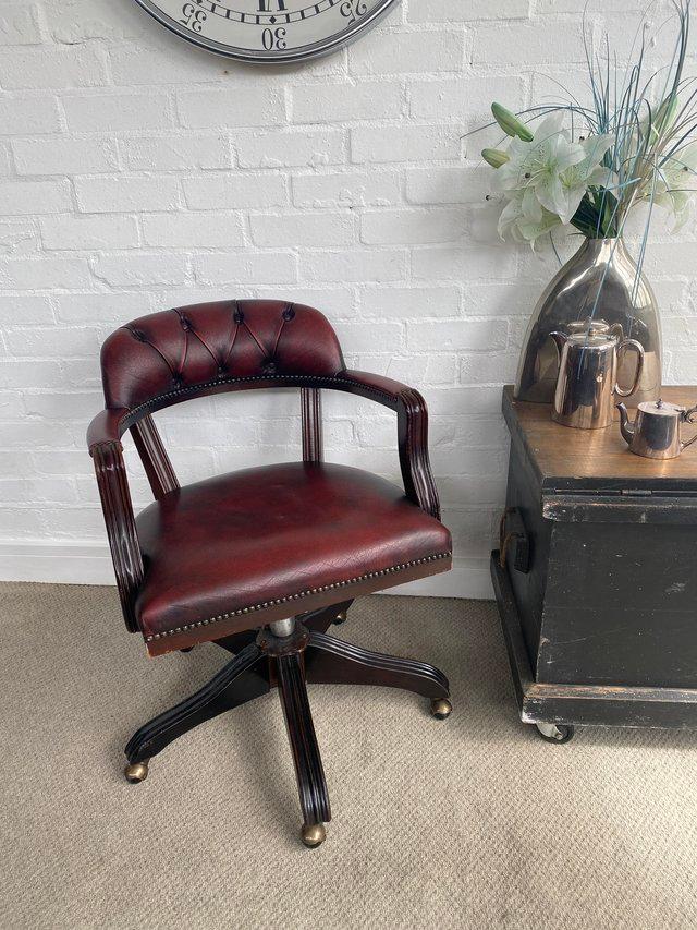 Preview of the first image of Oxblood Chesterfield captains chair. Can deliver..