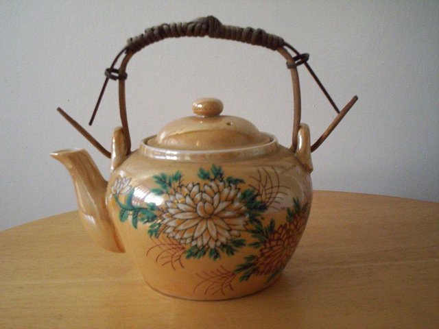 Preview of the first image of Chrysanthemums Decorated Ceramic Teapot & Infuser with Wick.