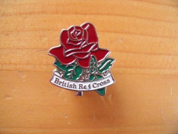 Image 1 of British Red Cross badge/pin + butterfly back.