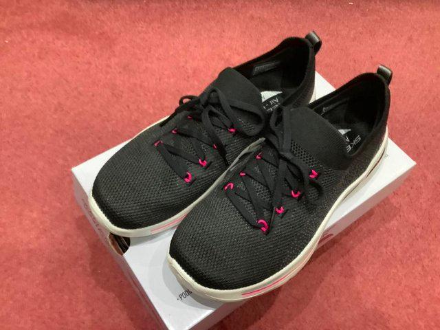 Preview of the first image of Skechers GoWalk Arch Fit trainers size 4.