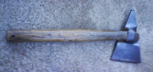 Image 1 of small triangular shaped axe, German 2nd ww.for display only.