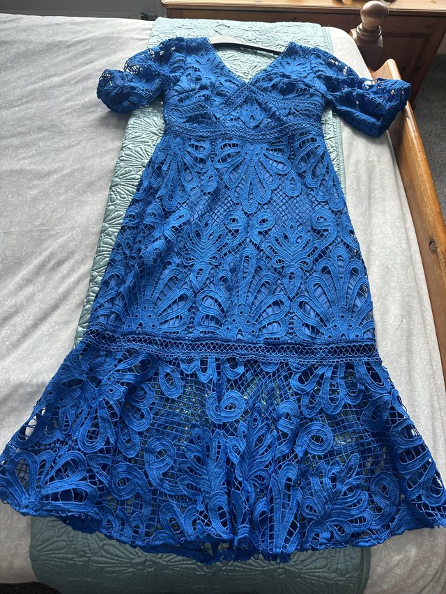 Preview of the first image of Lipsy Blue Lace Midi Dress - size 12.