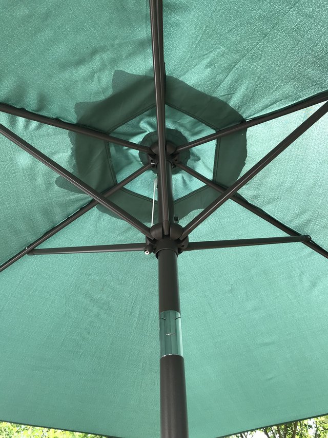 Preview of the first image of Green garden umbrella and stand.