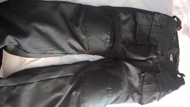 Preview of the first image of motorcycle textile armoured trousers.