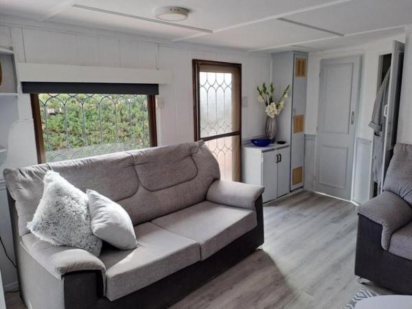 Image 10 of RS 1736 mobile home with communal pool and bar on site