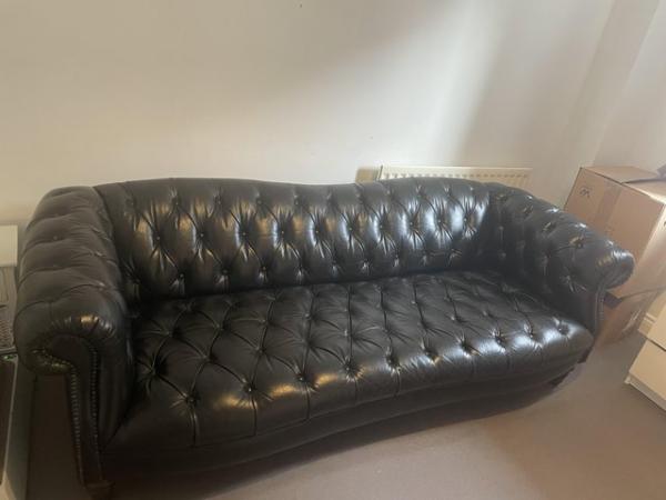 Image 1 of DFS black leather chesterfield sofa