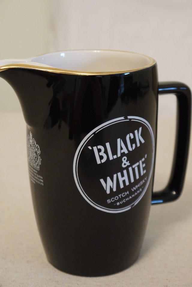 Preview of the first image of Wade Buchanans Black & White whisky water jug..